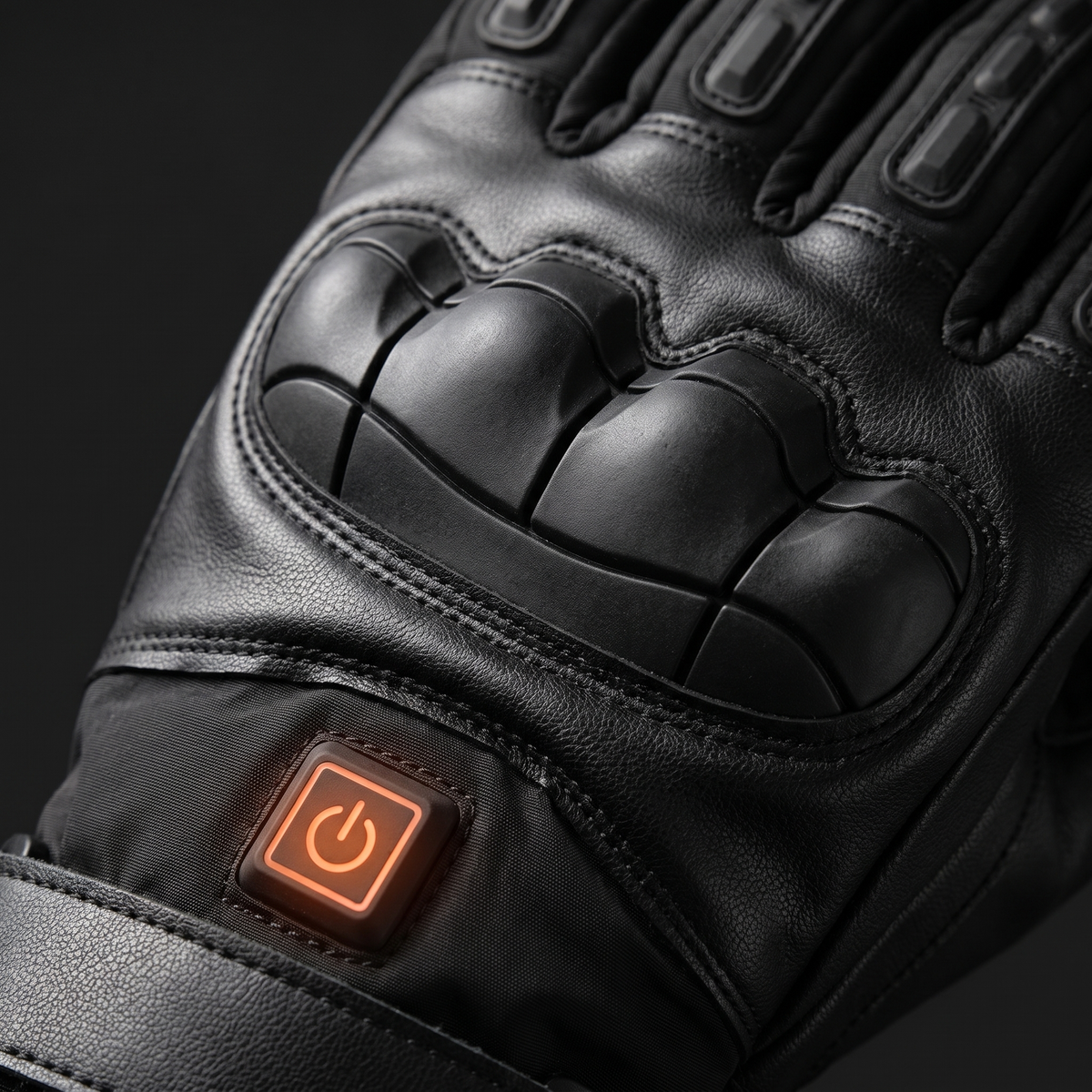 Close-up of the glove knuckle guard and power button